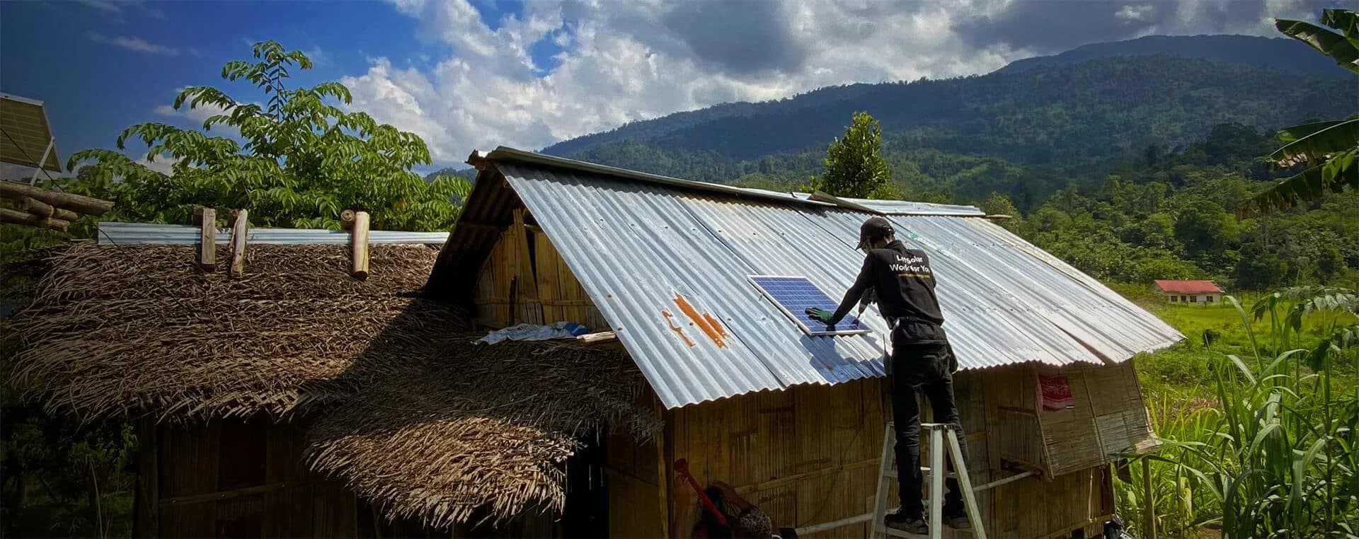 A solar-powered off-grid installation lighting a home at dusk